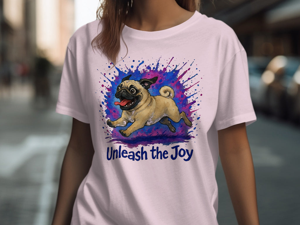 Light pink t-shirt with a pug illustration and the text "Unleash the Joy".