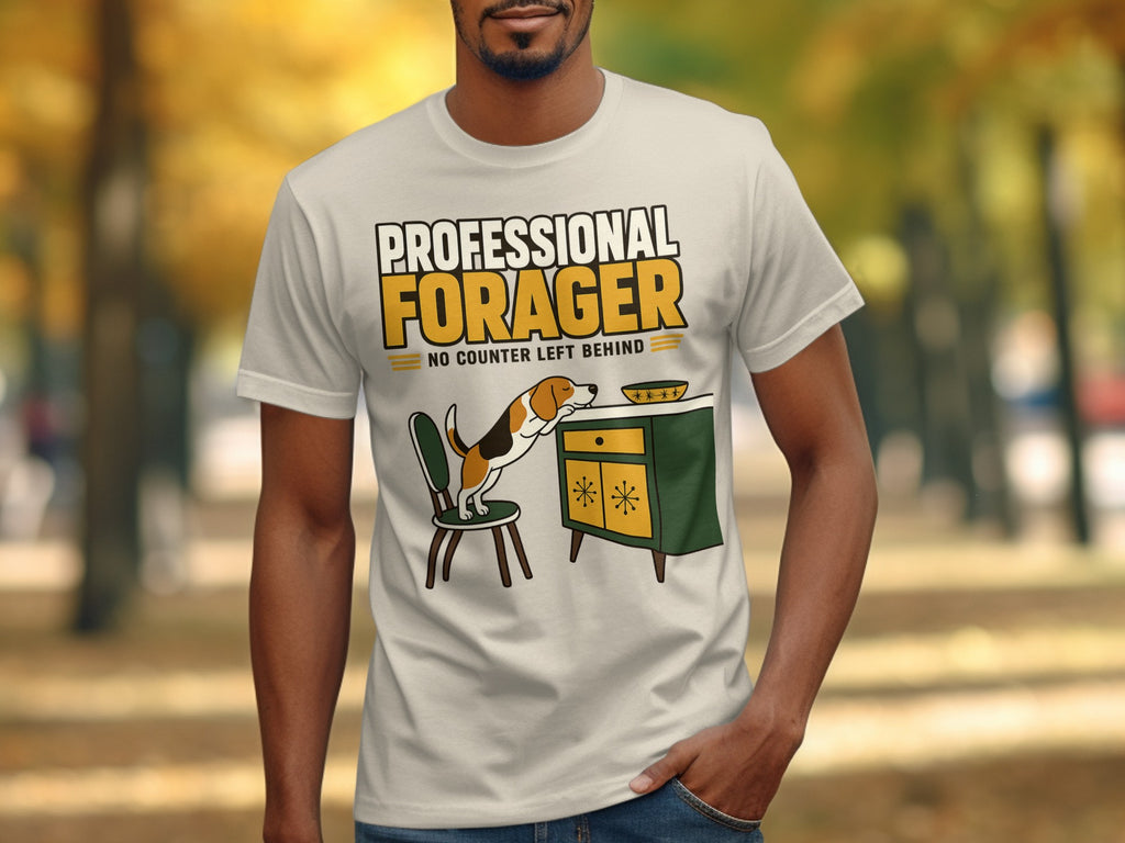 White t-shirt with "Professional Forager" text, dog reaching for bowl.