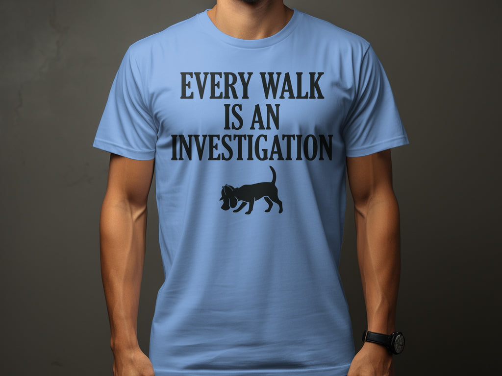 Light blue t-shirt with black text and a dog silhouette.