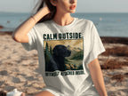 Black Labrador on white t-shirt with mountains, trees, and text: "CALM OUTSIDE. INTENSELY ATTACHED INSIDE."