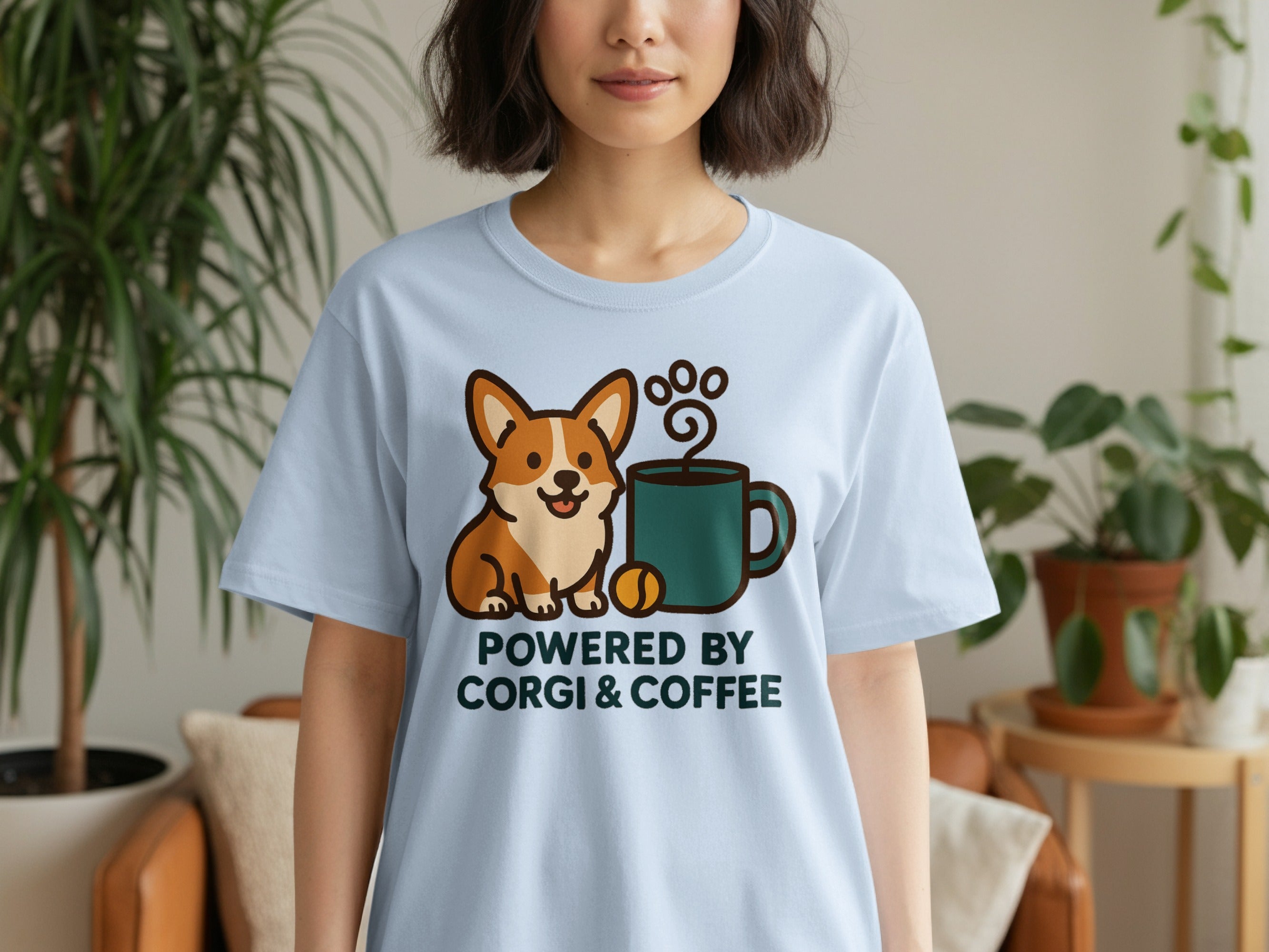 Light blue t-shirt with "Powered by Corgi & Coffee" and a corgi with coffee.