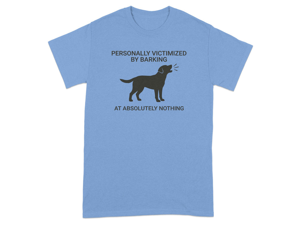 Light blue t-shirt with a black dog graphic and text "PERSONALLY VICTIMIZED BY BARKING AT ABSOLUTELY NOTHING."