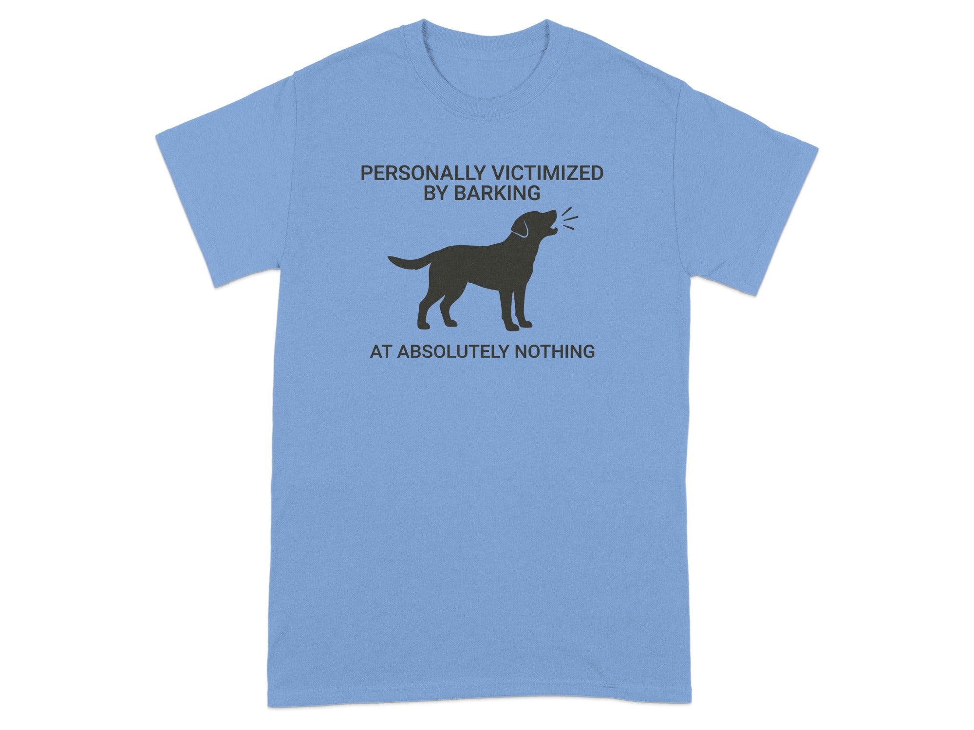 Light blue t-shirt with a black dog graphic and text "PERSONALLY VICTIMIZED BY BARKING AT ABSOLUTELY NOTHING."