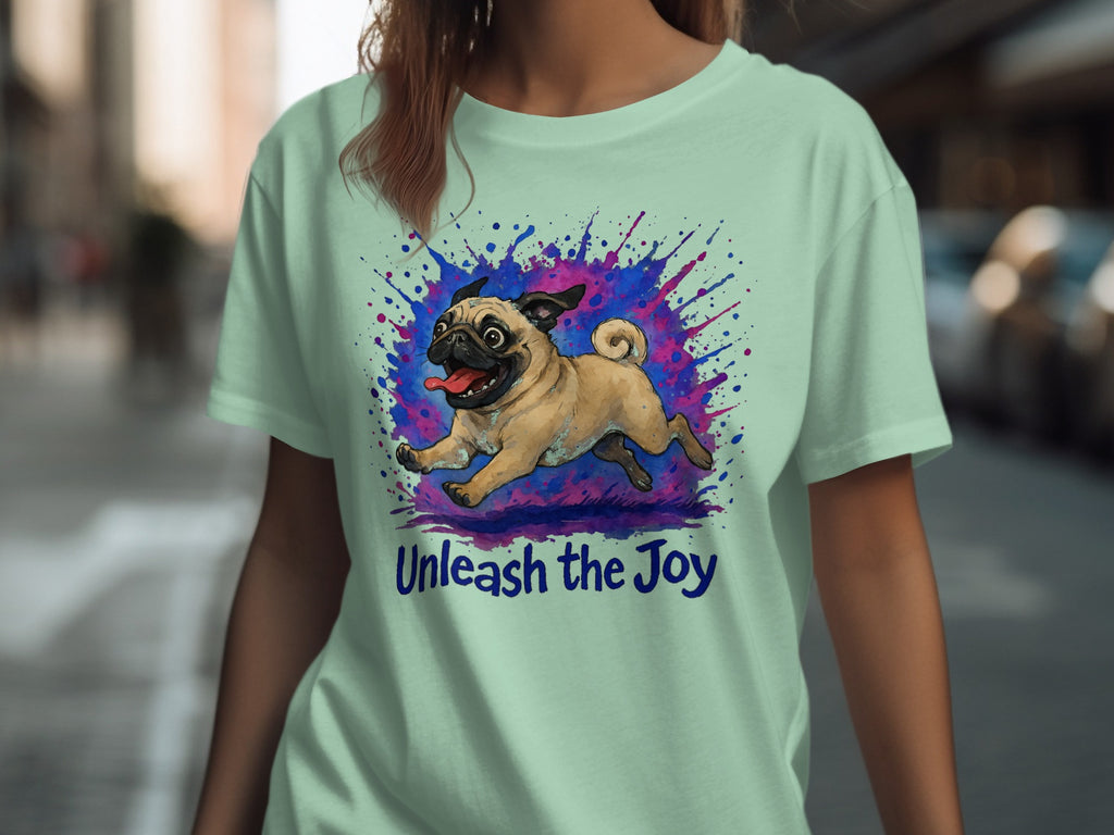 Light mint t-shirt with a pug illustration and "Unleash the Joy" text.