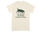 Beagle silhouette on cream t-shirt with text "Life update: My beagle smelled a thing."