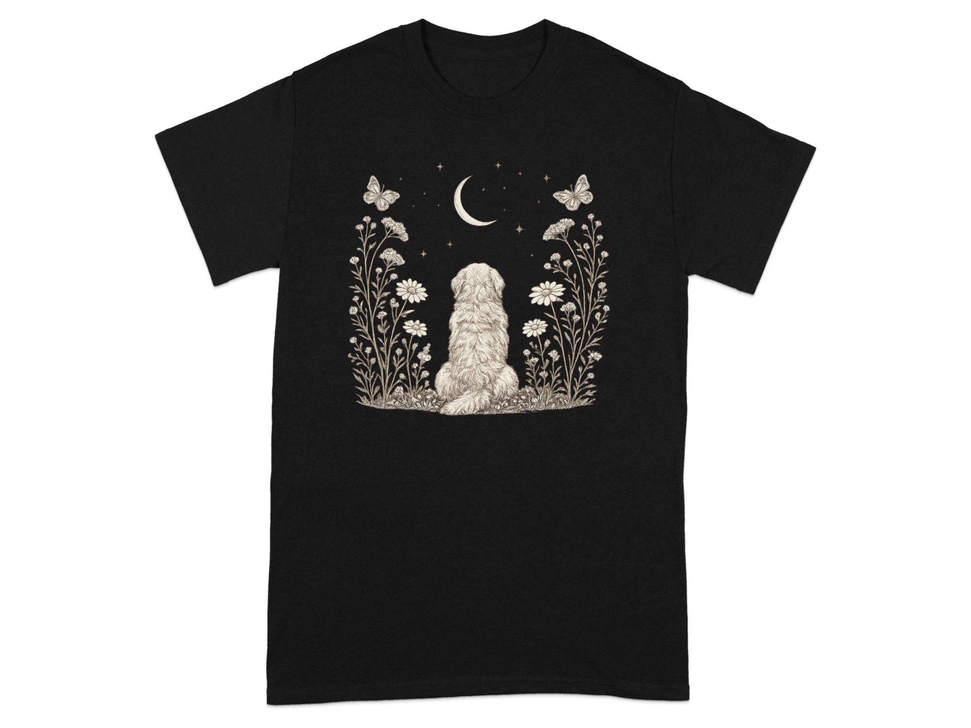 Black t-shirt with a fluffy dog, flowers, butterflies, and a crescent moon.