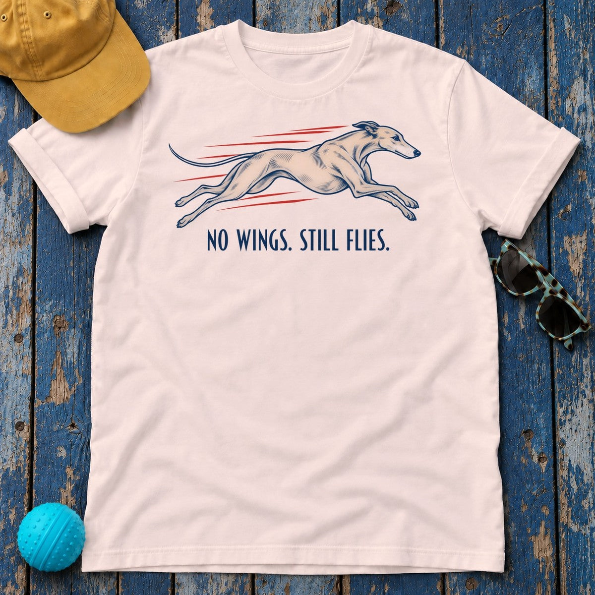 No Wings Still Flies Greyhound T-Shirt in Soft Pink - flat lay