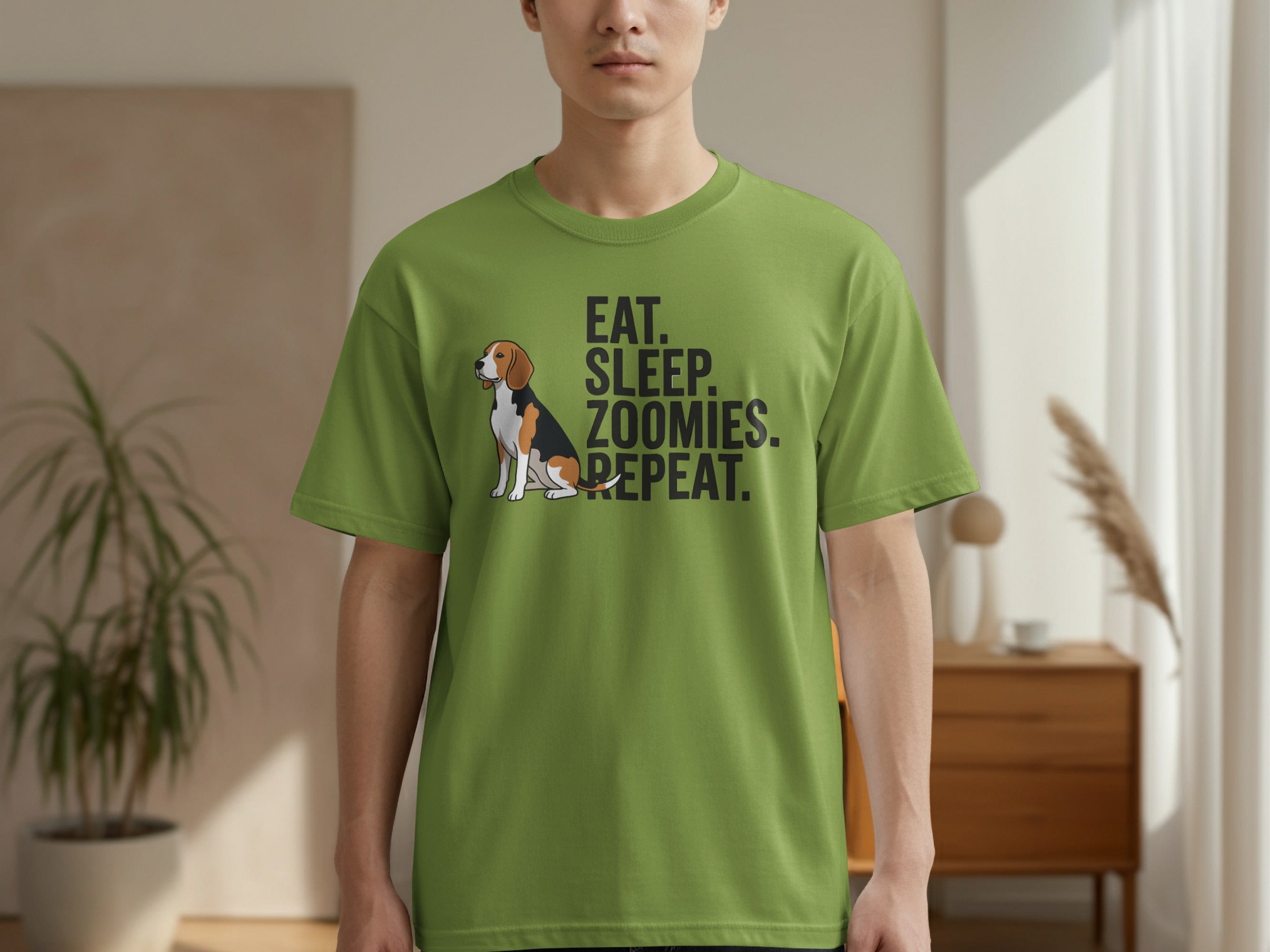 Green t-shirt with "EAT. SLEEP. ZOOMIES. REPEAT." and a beagle dog graphic.