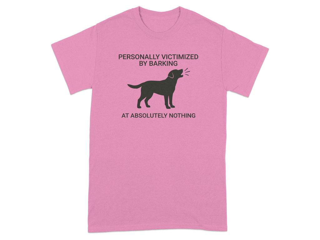 Pink t-shirt with a black dog silhouette and text "PERSONALLY VICTIMIZED BY BARKING AT ABSOLUTELY NOTHING".