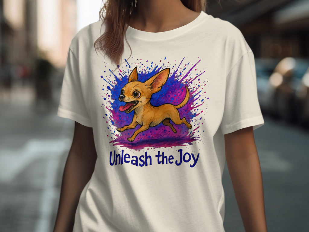 White t-shirt with cartoon chihuahua and "Unleash the Joy" text.