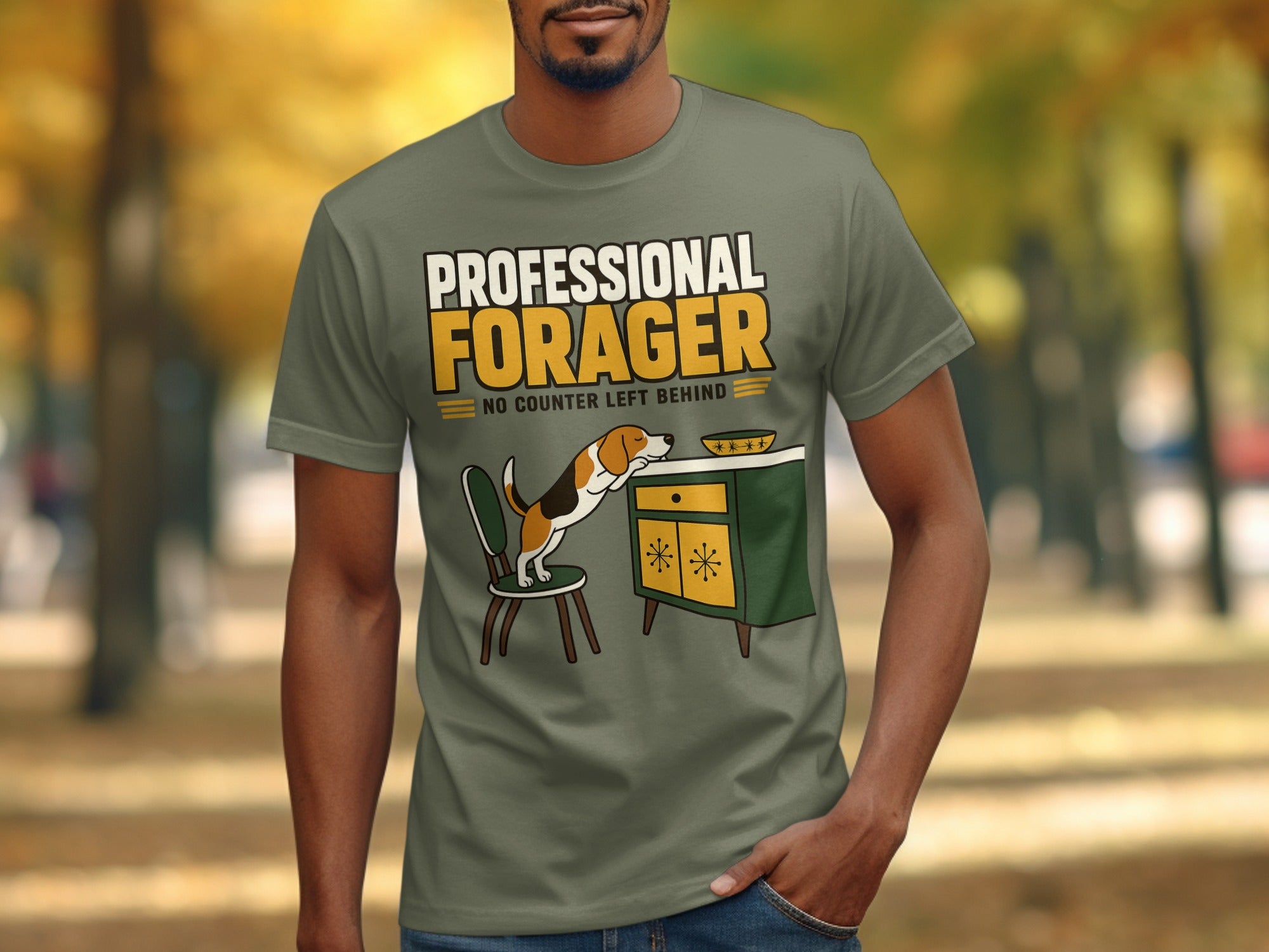 Green t-shirt with "Professional Forager" text and dog reaching for food.