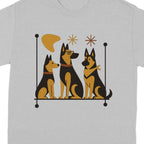 Three stylized German Shepherds sit on a shelf with abstract shapes above them.