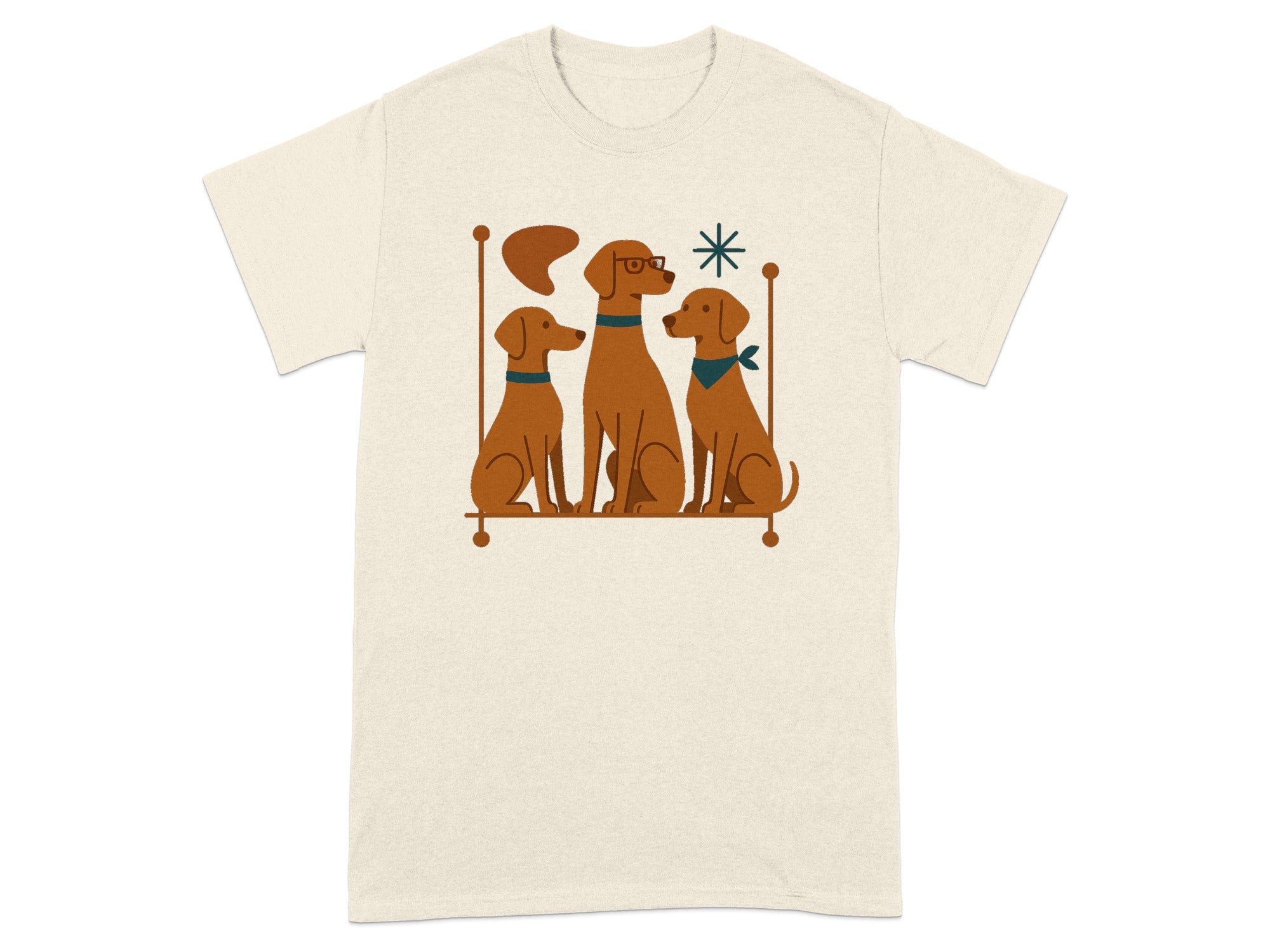 Three brown dogs sit next to each other, one wearing glasses, on a beige t-shirt.