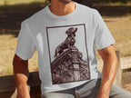 White t-shirt with a detailed etching of a dachshund standing on ornate architecture.