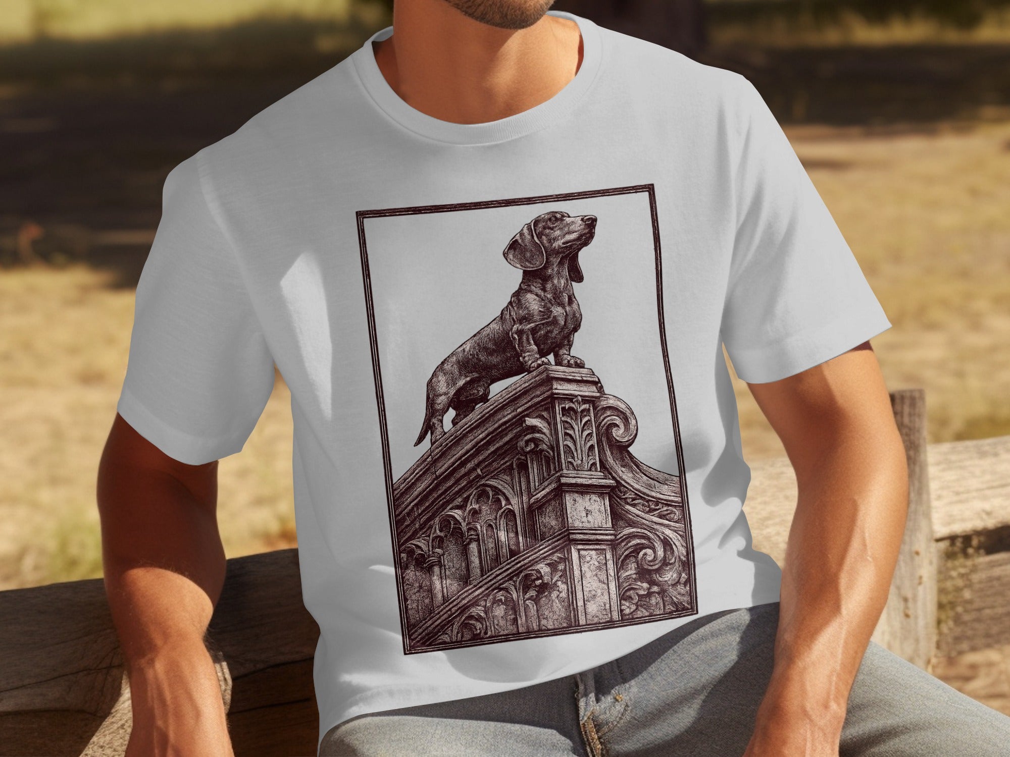 White t-shirt with a detailed etching of a dachshund standing on ornate architecture.