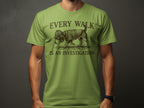 Green t-shirt with dog wearing detective hat and coat, text "EVERY WALK IS AN INVESTIGATION".