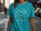 Turquoise t-shirt with white outline of a dog and text "Slow down, enjoy walks."
