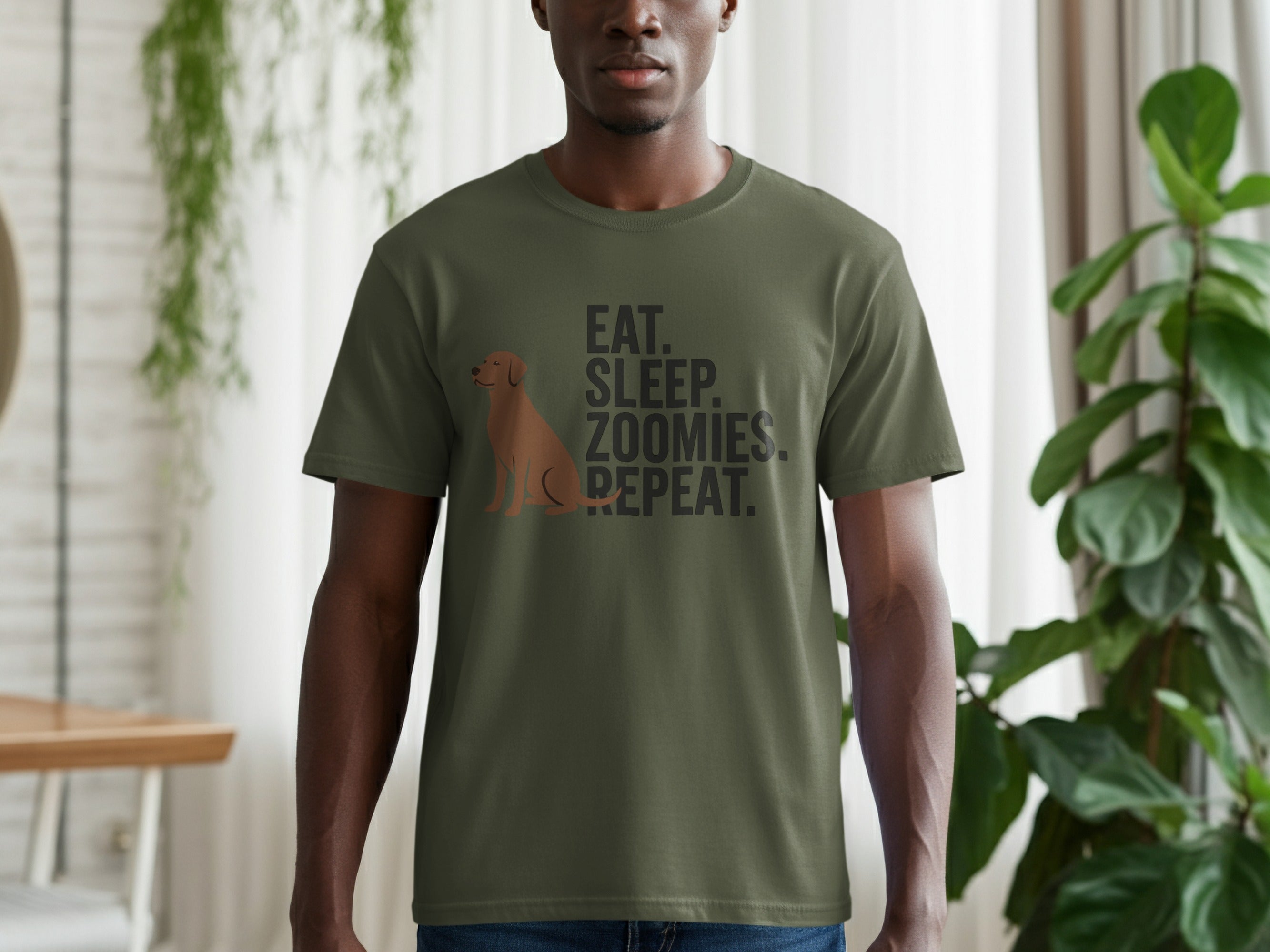 Olive green t-shirt with brown dog and "EAT. SLEEP. ZOOMIES. REPEAT." text.