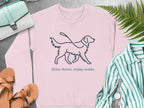 Pink sweatshirt with "Slow down, enjoy walks" text and a dog illustration.
