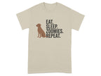 Light tan t-shirt with a brown dog silhouette and text "EAT. SLEEP. ZOOMIES. REPEAT."