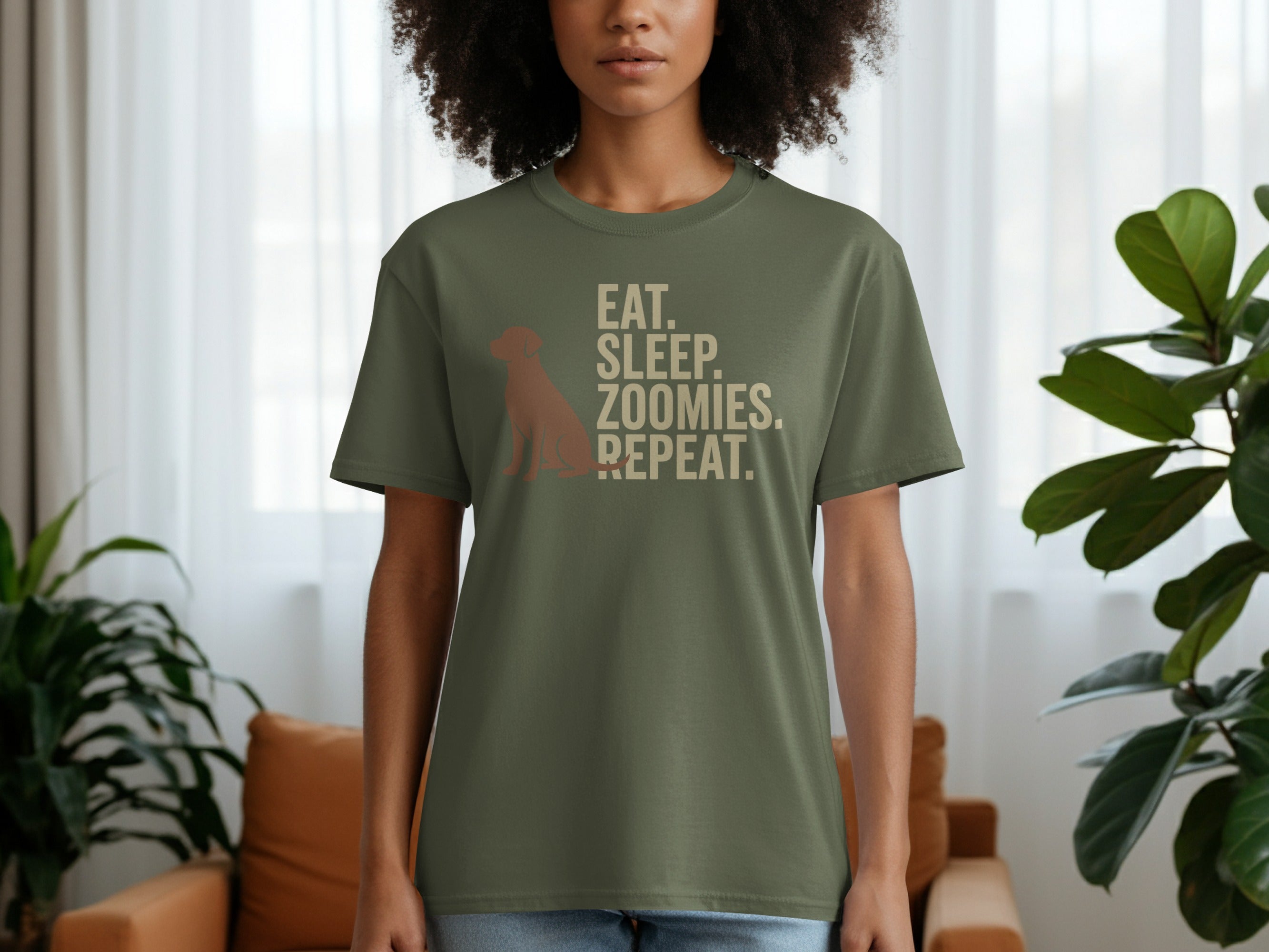 Olive green t-shirt with "EAT. SLEEP. ZOOMIES. REPEAT." text and dog silhouette.