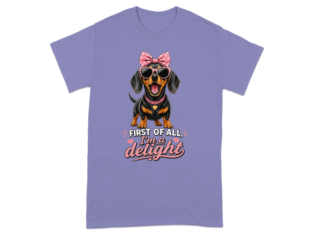 Dachshund wearing sunglasses and a pink bow, with "First of all, I'm a delight" text.