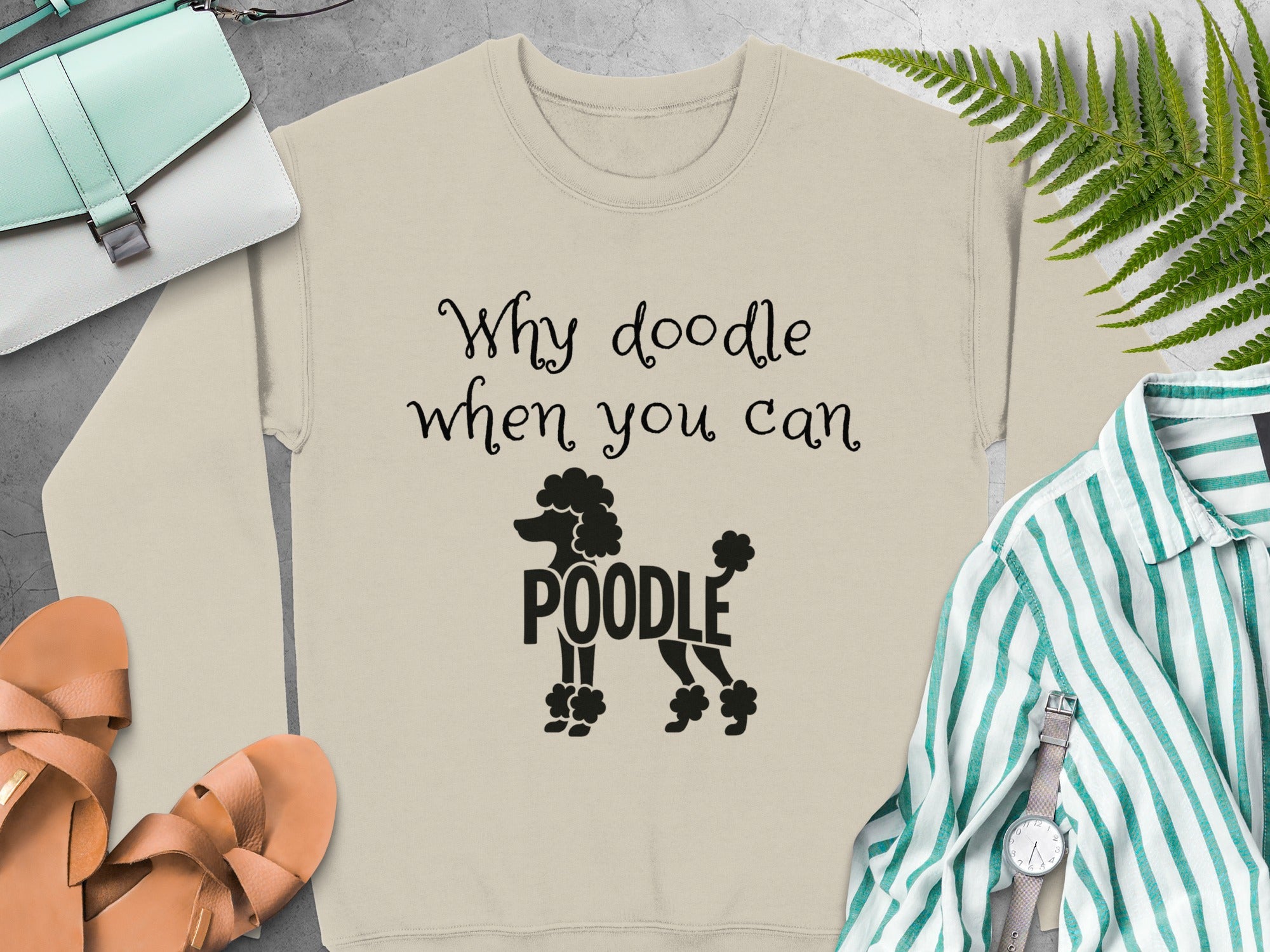 Crewneck sweatshirt with "Why doodle when you can Poodle" text and poodle silhouette.