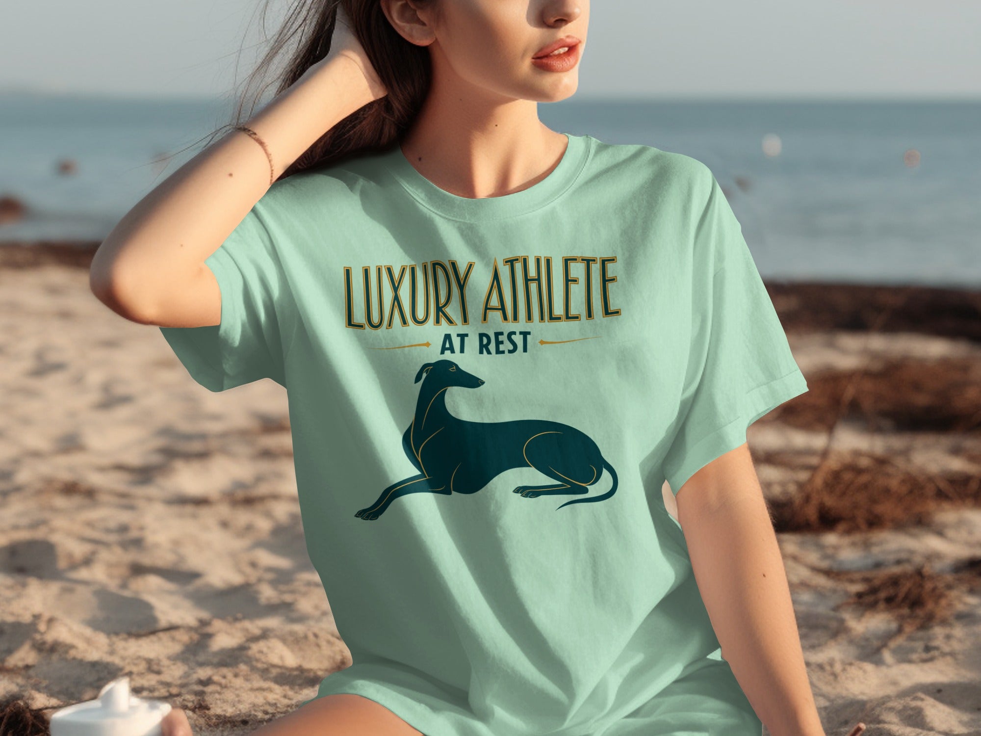 Light blue t-shirt with "Luxury Athlete at Rest" and a greyhound graphic.