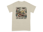 T-shirt with a dog in a hat sniffing the ground, text "Sniff First Ask Questions Later".