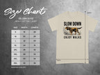 T-shirt size chart with graphic of dog on a leash.