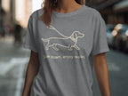 Grey t-shirt with a line drawing of a dachshund and the text "Slow down, enjoy walks".