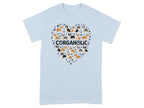 Light blue t-shirt with a heart of corgis and paw prints.