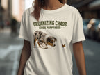 Woman wearing a t-shirt with "ORGANIZING CHAOS SINCE PUPPYHOOD" and a puppy.