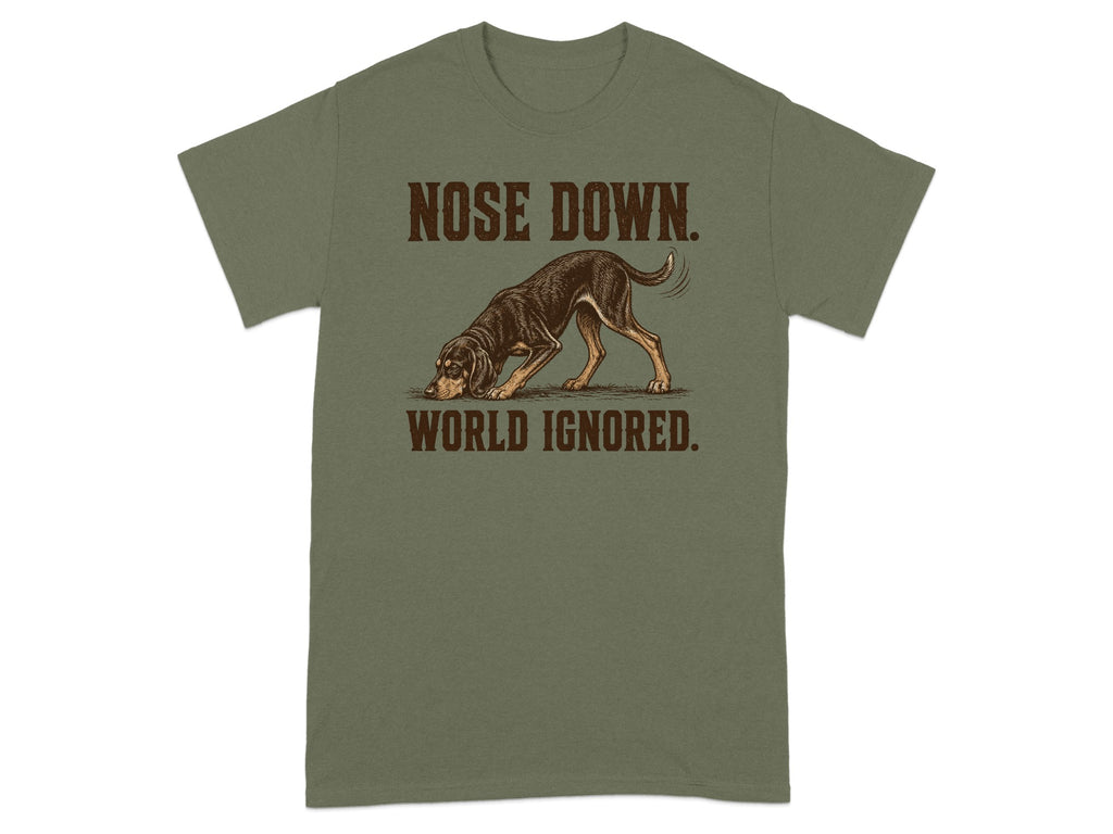 Green t-shirt with illustration of dog with nose to ground and text "NOSE DOWN. WORLD IGNORED."