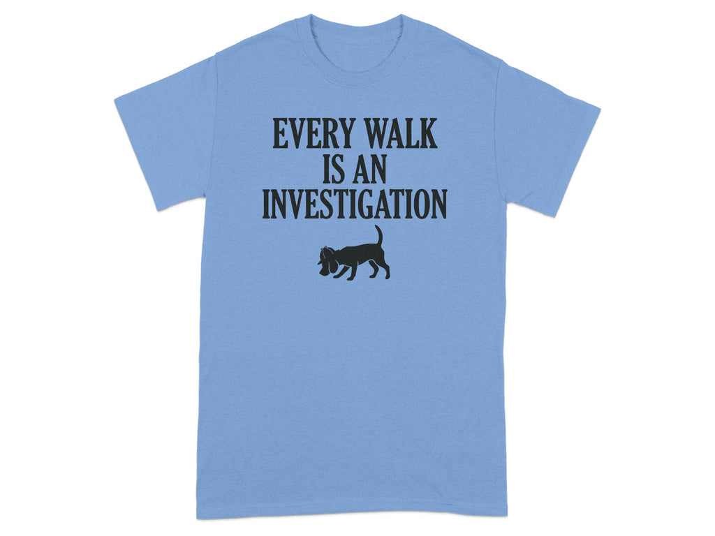 Light blue t-shirt with "EVERY WALK IS AN INVESTIGATION" and a dog silhouette.