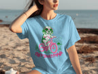Light blue t-shirt with a cartoon dog riding a bicycle, text reads "Off to cause a kerfuffle".