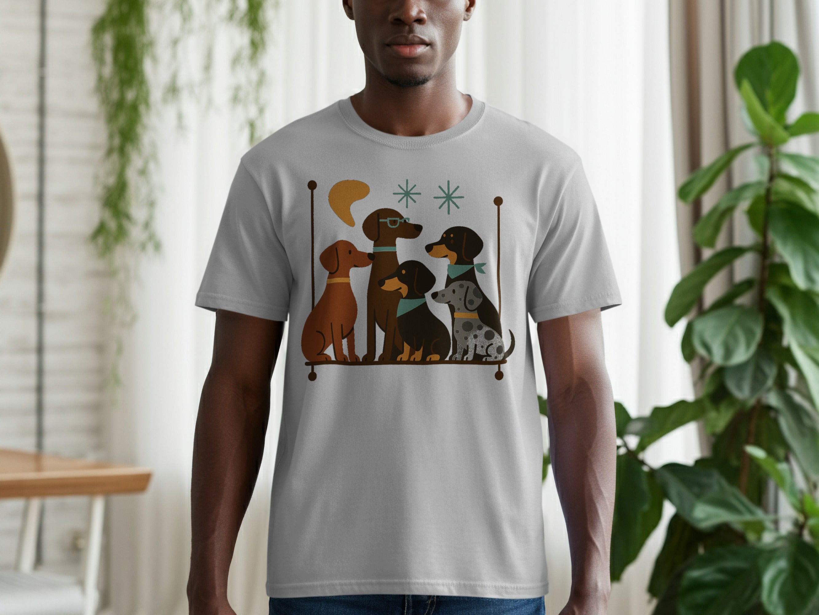 Grey t-shirt with a graphic of five cartoon dogs sitting on a shelf.