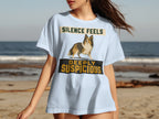 Light blue t-shirt with a dog and the text "SILENCE FEELS DEEPLY SUSPICIOUS".