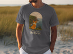 Dark grey t-shirt featuring a corgi looking at a coastal cliff scene with text.