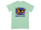 Green t-shirt with running German Shepherd and text "UNLEASH the Joy".