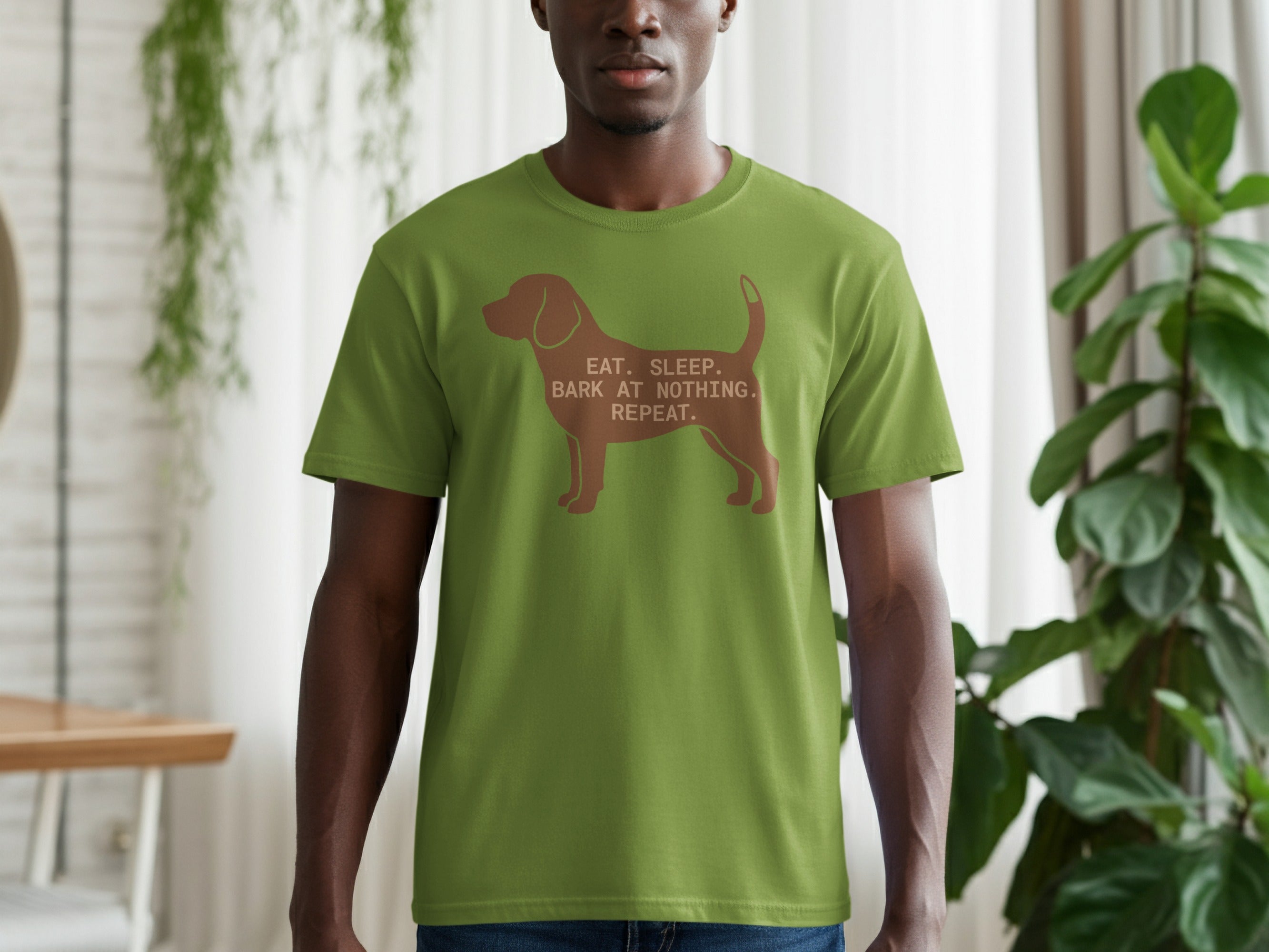 Green t-shirt with dog silhouette and "Eat. Sleep. Bark at Nothing." text.