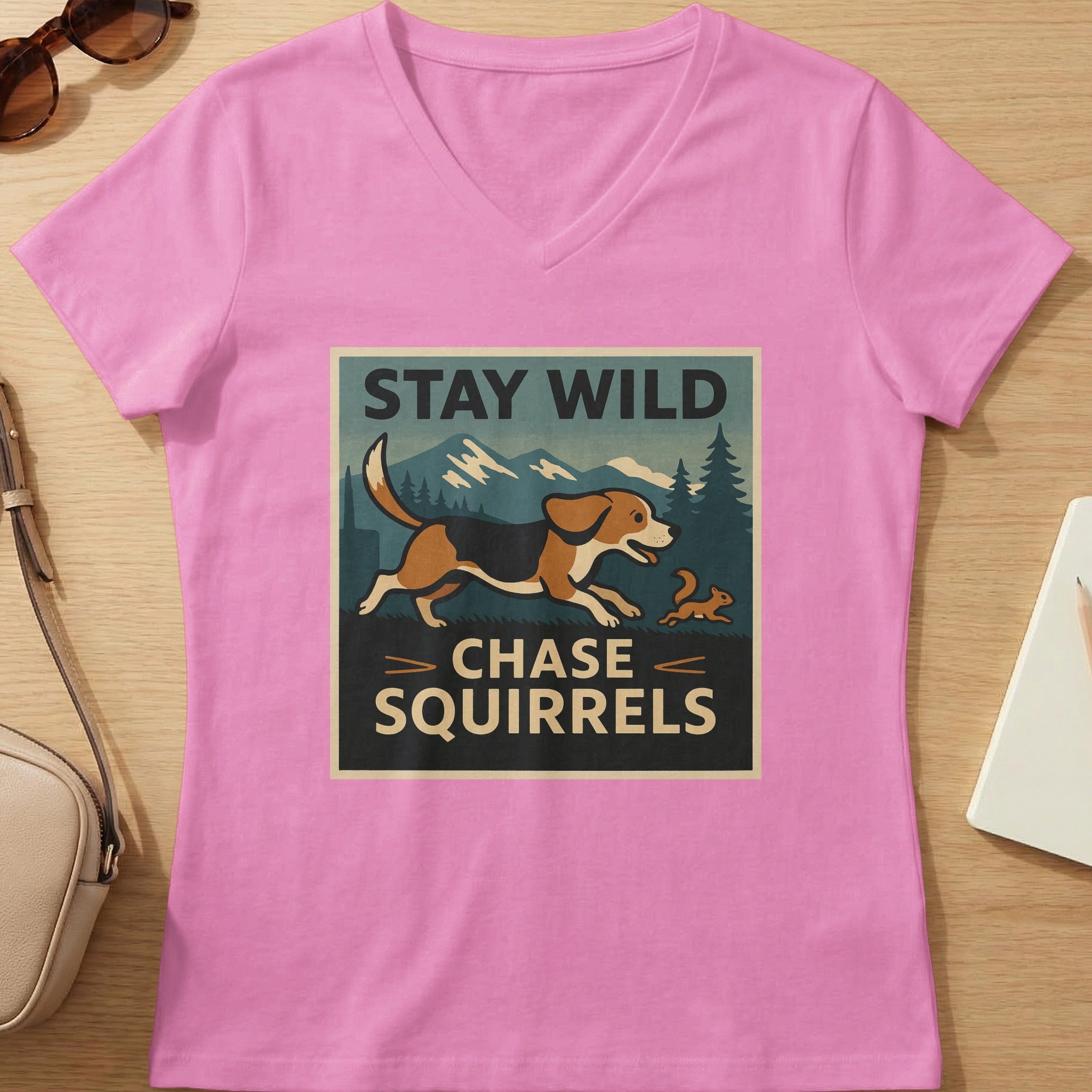 Pink t-shirt with "STAY WILD CHASE SQUIRRELS" graphic featuring a beagle and squirrel.
