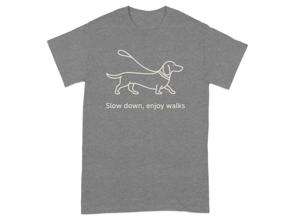 Grey t-shirt with a line drawing of a dachshund on a leash and text that reads "Slow down, enjoy walks."