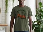 Olive t-shirt with a graphic of a brown dachshund sniffing and text "TRUST THE NOSE."