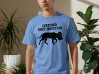 Light blue t-shirt with black graphic of a dog wearing a detective hat and the text "CERTIFIED SNIFF INSPECTOR".