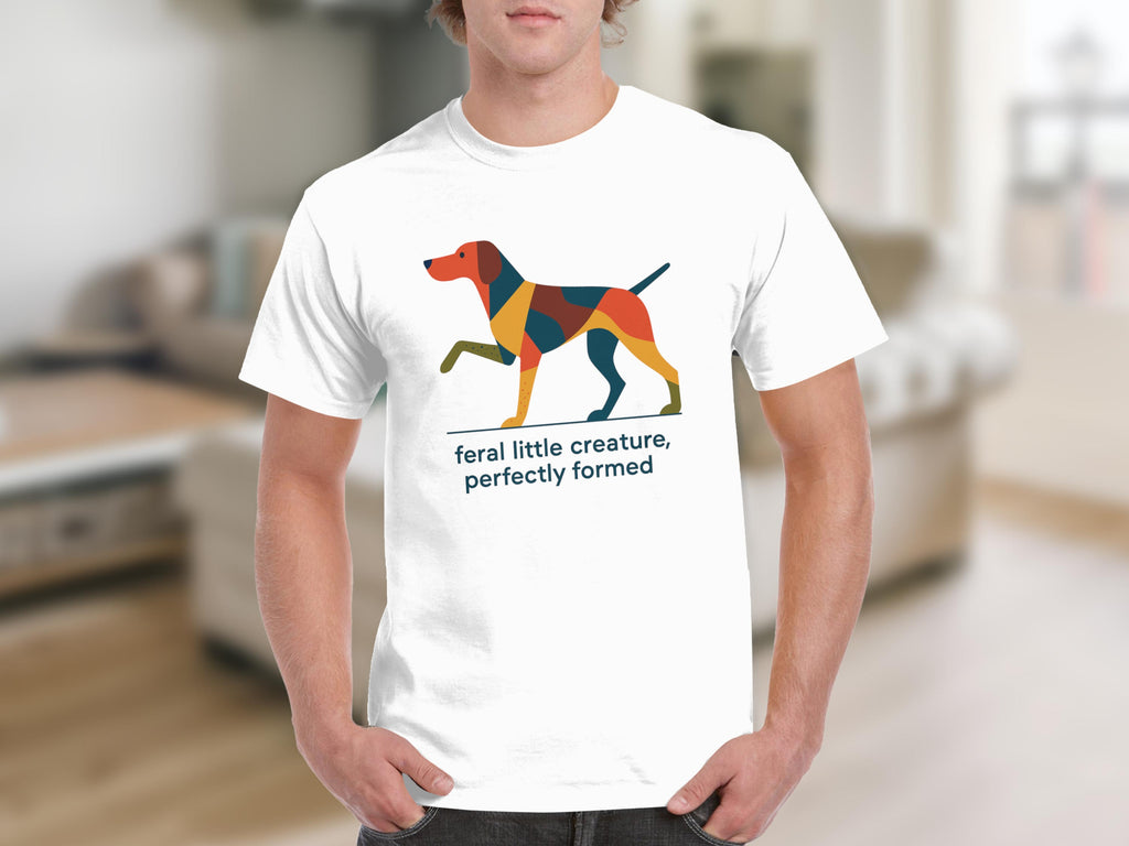 White t-shirt with a geometric dog graphic and text "feral little creature, perfectly formed".