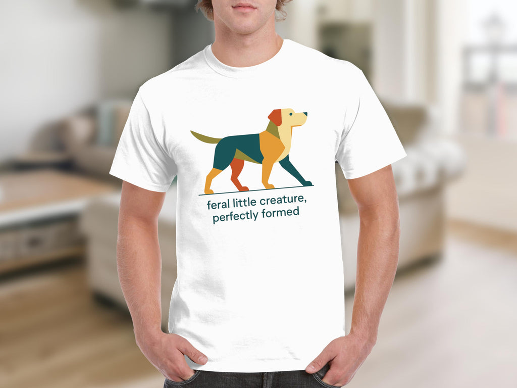 White t-shirt with geometric dog graphic and text "feral little creature, perfectly formed".