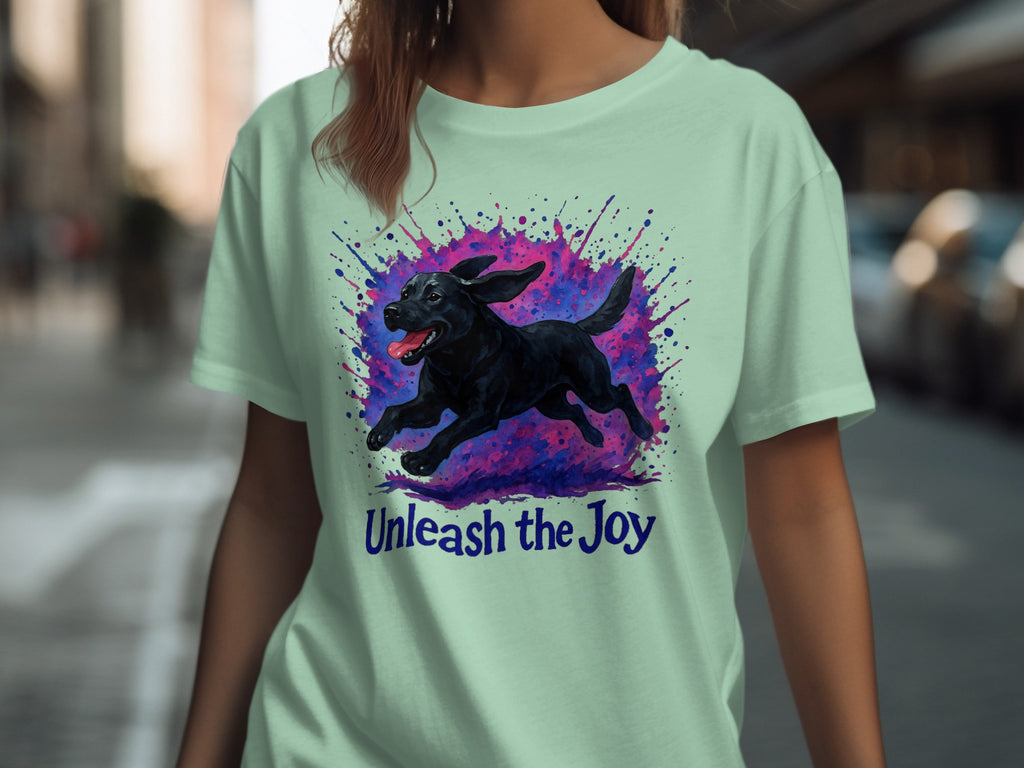 Black Labrador running through colorful paint splatters, text "Unleash the Joy".
