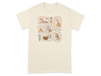 T-shirt with four framed illustrations of corgis and dog accessories.