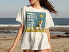 White t-shirt with "Beagle Days Are The Best Days" graphic and a beagle on a beach.